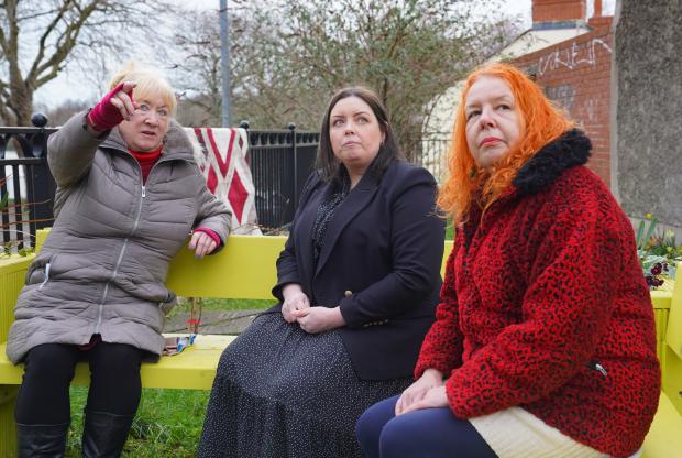 Communities Minister Deirdre Hargey is pictured with local residents of the Holyland Brid Ruddy (L) and Catriona Goldhammers (R) 