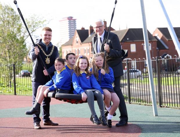 DfC Perm Sec Colum Boyle pictured with Lord Mayor Ryan Murphy and children from the community