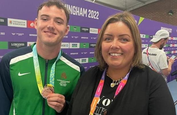 Communities Minister Deirdre Hargey is pictured with gymnast Rhys McClenaghan who won a silver medal at the Commonwealth Games