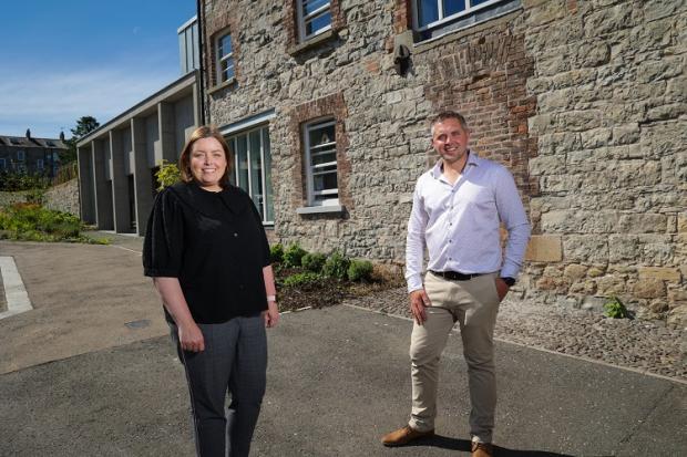 Communities Minister Deirdre Hargey is pictured with Christopher Gill from Caledon Regneration Partnership at Caledon Wool Store in Co Tyrone 