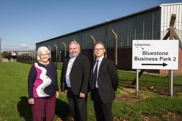Marking the handover of land, where Bluestone Business Park is situated, from DfC to Brownlow Limited through a Community Asset Transfer are: Dian Heaney MBE, Chairperson of Brownlow Limited, Gerard Murray, Director of Regional Development Office at DfC 