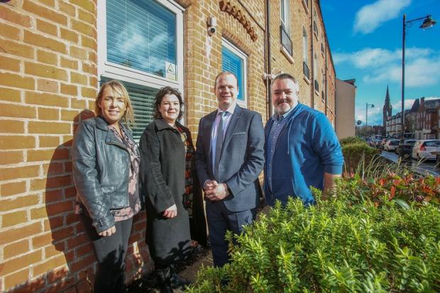 Communities Minister Gordon Lyons visits a supported living scheme for younger people in south Belfast. The scheme is run by MACS, and the Minister is pictured with staff members Trina Harpur, Kate Martin (MACS CEO) and Mark McQuillan. 