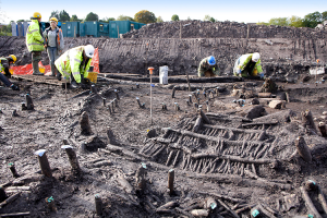 Excavation at drumclay crannog showing habitation layer with circular house and fallen wickerscreen wall