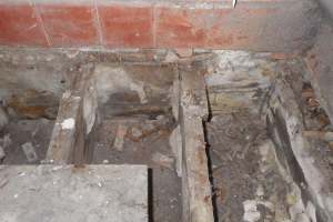 Blocked up vents below a suspended timber floor can lead to dry rot.  This situation can be repaired and the conditions for dry rot also removed by allowing sufficient air flow beneath the floor