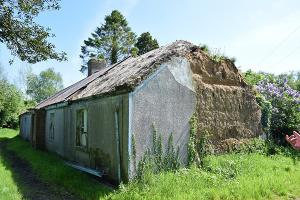 A thatched roofed, mud walled house in disrepair, off Derrinraw Road, The Biches, Craigavon
