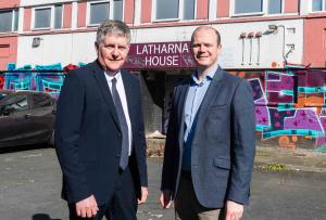 Communities Minister Gordon Lyons and Roy McClean, NIHE Assistant Area Manager for Mid and East Antrim, pictured outside Latharna House in Larne