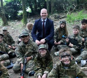 Communities Minister Gordon Lyons pictured with children from the Action Deaf Youth summer scheme as he celebrates the Sign Language Act achieving Royal Assent