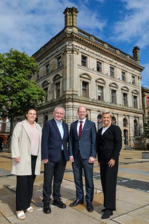 Pictured (L-R) outside the former Danske Bank building in Londonderry are Shona Campbell, General Manager Inner City Trust; Damian McAteer, Inner City Trust; Communities Minister Gordon Lyons MLA and Vicki Hassan, Operations Director at Danske Bank