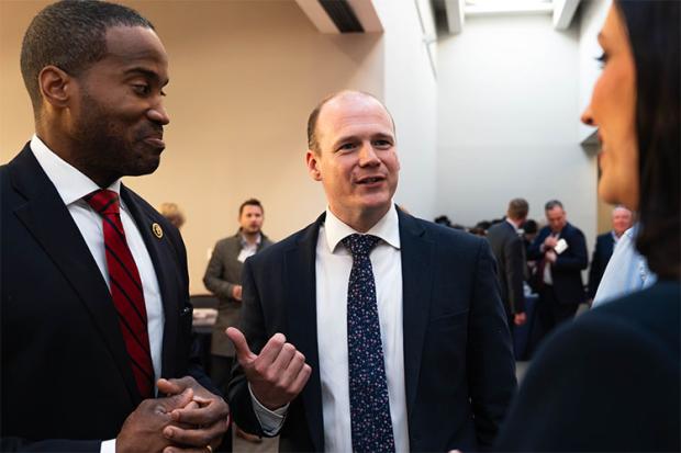 Minister Gordon Lyons (centre) pictured in the Hart Senate building, Washington, DC, with Representative John James (left)