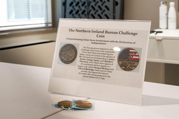 A photo of the Northern Ireland Bureau Challenge Coin, which commemorates Ulster-Scots Involvement with the Declaration of Independence