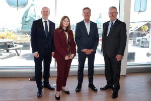 Communities minister, Gordon Lyons, Economy minister Caoimhe Archibald, and Health minister, Mike Nesbitt with Commission chair, Alan Milburn 