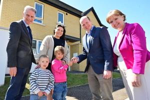 Communities Minister Gordon Lyons pictured with Michael McDonnell, Choice Group Chief Executive; Lyndsay Carr and two of her children Jessica and Luke; and Nicole Lappin, Chair, Northern Ireland Housing Executive.