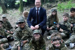 Communities Minister Gordon Lyons pictured with children from the Action Deaf Youth summer scheme as he celebrates the Sign Language Act achieving Royal Assent