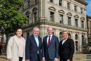 Pictured (L-R) outside the former Danske Bank building in Londonderry are Shona Campbell, General Manager Inner City Trust; Damian McAteer, Inner City Trust; Communities Minister Gordon Lyons MLA and Vicki Hassan, Operations Director at Danske Bank