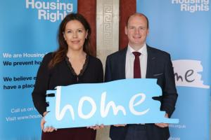 Communities Minister Gordon Lyons pictured with Housing Rights CEO Katie McCauley at Parliament Buildings.